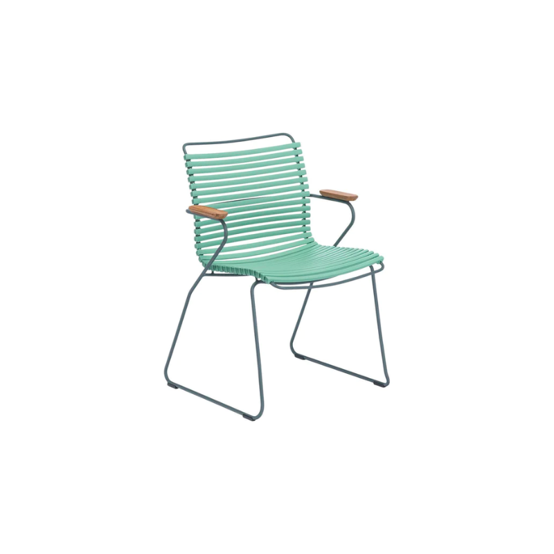 CLICK outdoor dining armchair is simple, honest, and ergonomically well thought out. It is beautiful in its repetition around the table and because the slats (lamellas) can be replaced, you can mix and change the colors as often as you like. These outdoor dining chairs are stackable and easy to store. 