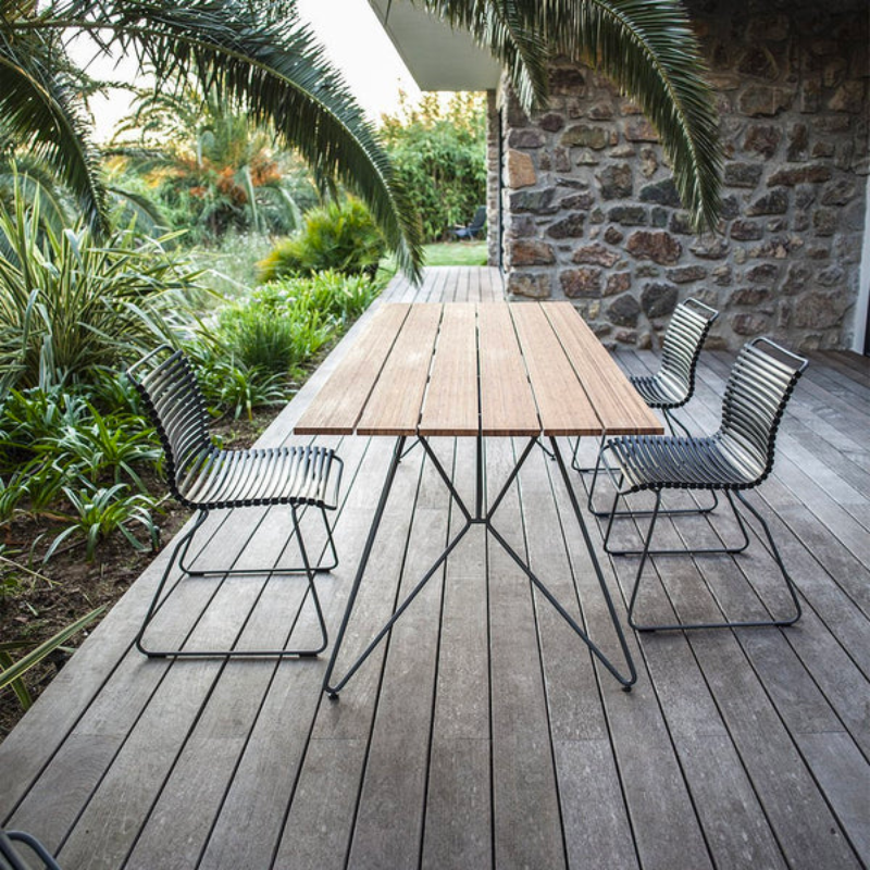 CLICK outdoor chair is simple, honest, and ergonomically well thought out. It is beautiful in its repetition around the table and because the slats (lamellas) can be replaced, you can mix and change the colors as often as you like. These outdoor dining chairs are stackable and easy to store. 
