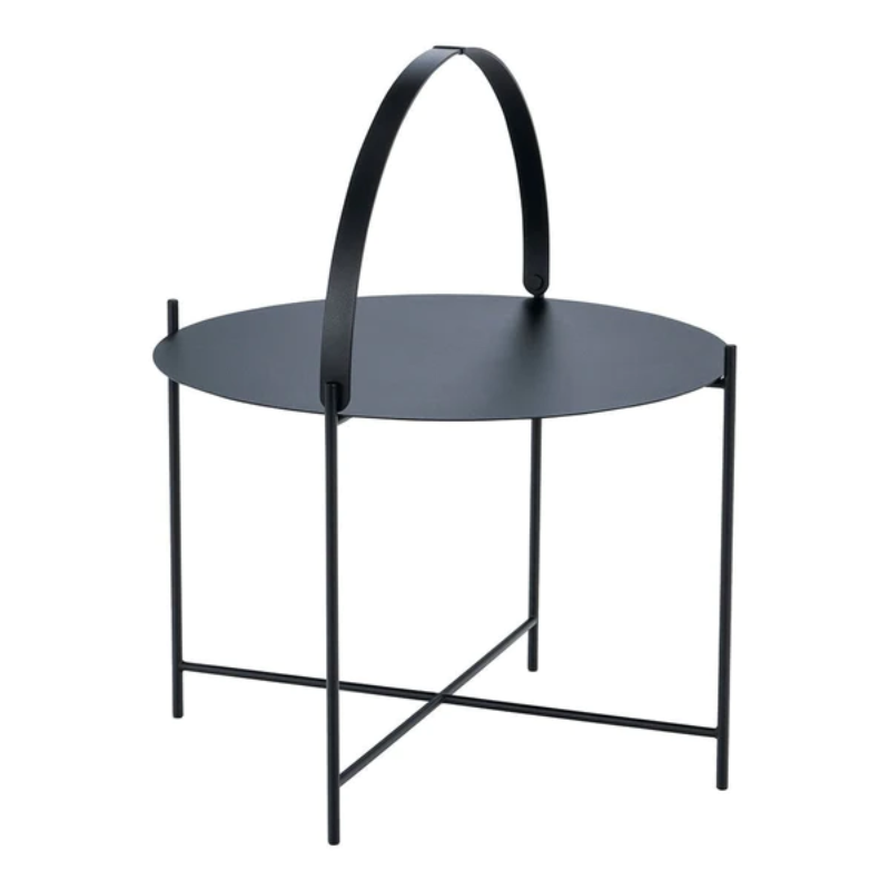 The EDGE tray table is a versatile piece of furniture that can be used both indoors and outdoors. It is made of powder-coated metal and comes in three different sizes. The half-ring shaped handle makes it easy to move the table between the living room and the garden, and when laid down it functions as a table edge making sure everything stays in place.