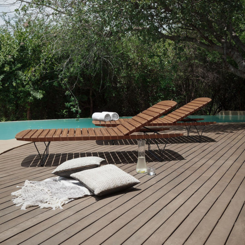 The MOLO Sunbed is made from bamboo lamellas with a decorative leg construction. The surface is made from soft rounded bamboo lamellas combined with a metal frame to lead the mind towards a pier and the relaxed atmosphere by the sea.