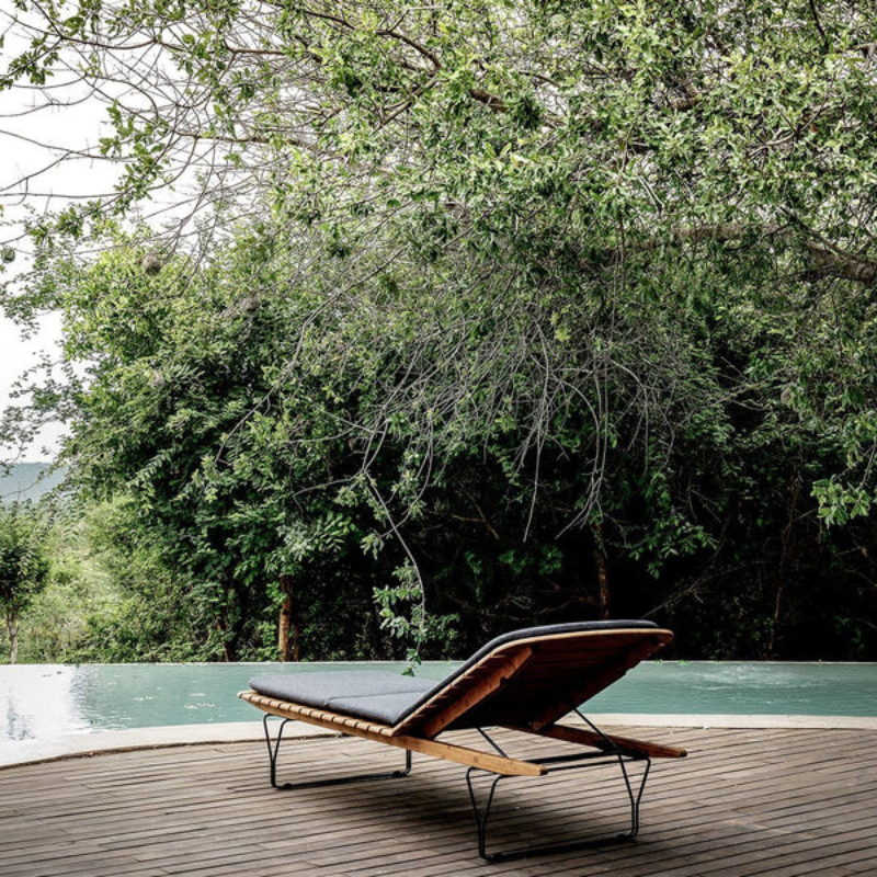 The MOLO Sunbed is made from bamboo lamellas with a decorative leg construction. The surface is made from soft rounded bamboo lamellas combined with a metal frame to lead the mind towards a pier and the relaxed atmosphere by the sea.