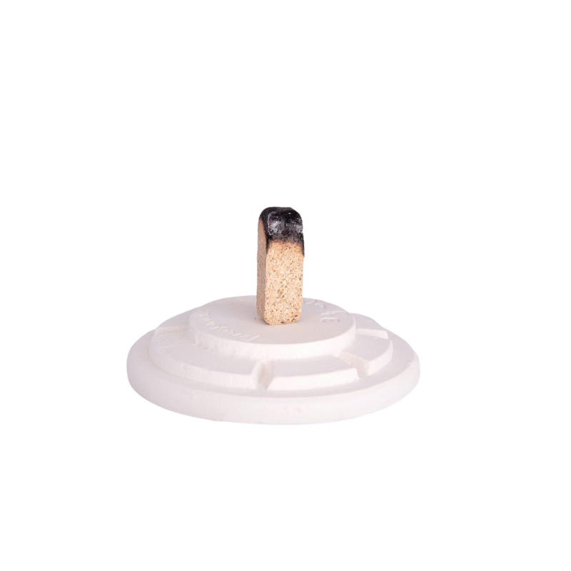 The White Teepee Incense Burner from Inscents opened up, revealing the incense.