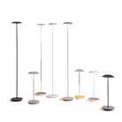 The Royyo Floor Lamp from Koncept in a studio lifestyle photograph with all body colors of the Royyo family in both the floor and table models.
