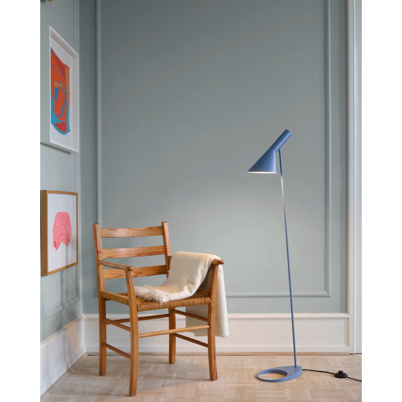 The AJ Floor Lamp designed by Arne Jacobsen for Louis Poulsen features a slim profile that fits in perfectly with every room. The fixture emits downward-directed light and the angle of the shade can be adjusted to optimize light distribution.