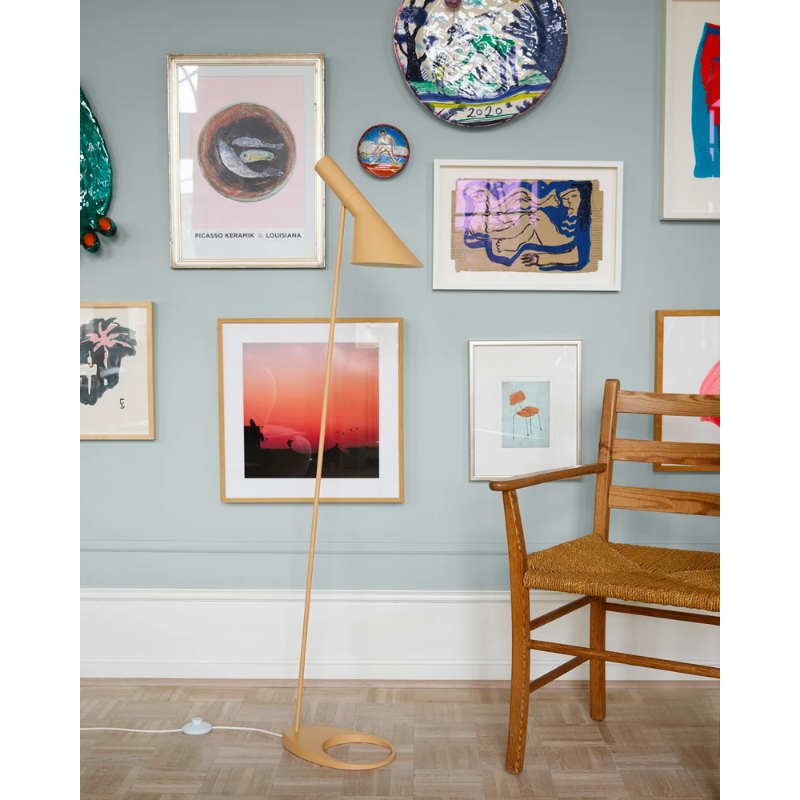 The AJ Floor Lamp designed by Arne Jacobsen for Louis Poulsen features a slim profile that fits in perfectly with every room. The fixture emits downward-directed light and the angle of the shade can be adjusted to optimize light distribution.