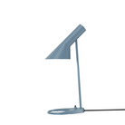The AJ Mini Table Lamp from Louis Poulsen in dusty blue.
