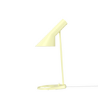 The AJ Mini Table Lamp from Louis Poulsen in soft lemon.
