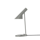 The AJ Mini Table Lamp from Louis Poulsen in warm grey.