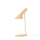 The AJ Mini Table Lamp from Louis Poulsen in warm sand.