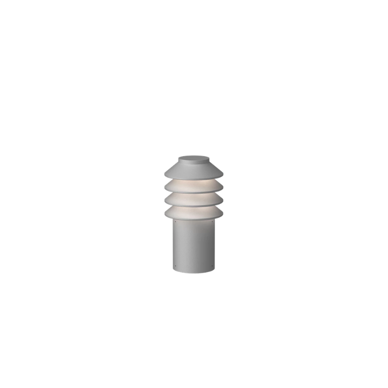 Its downscaled design is based on the same concept as the original Bysted. Four rings redirect the light downward while glowing at night and giving the product individuality and character. 