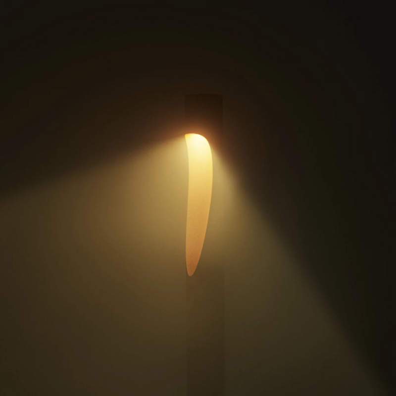 The Flindt Garden Bollard, crafted by renowned Danish designer Christian Flindt with Louis Poulsen, offers premier outdoor illumination for spaces like parks, courtyards, and gardens without sacrificing light quality or design. 