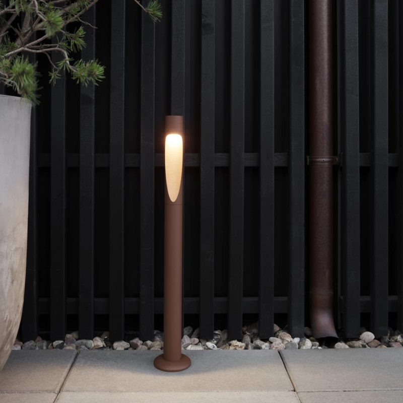 The Flindt Garden Bollard, crafted by renowned Danish designer Christian Flindt with Louis Poulsen, offers premier outdoor illumination for spaces like parks, courtyards, and gardens without sacrificing light quality or design. 