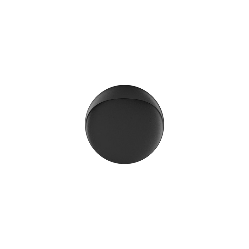 The Flindt Wall is distinguished by a light egress from an opening in the top that emits light down the front of the fixture, creating a subtle, glowing ring of reflected light on the transition between the concave and convex shapes. The oval shape is lifted off the mounting surface, giving the fixture a floating appearance.
