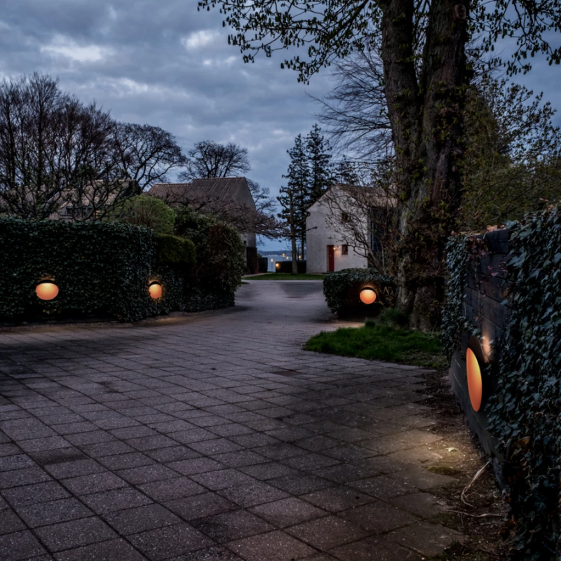 The Flindt Wall from Louis Poulsen in a driveway.