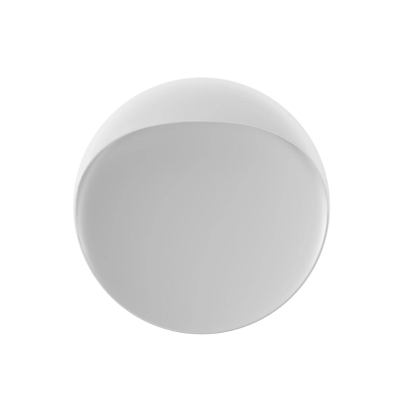 The Flindt Wall is distinguished by a light egress from an opening in the top that emits light down the front of the fixture, creating a subtle, glowing ring of reflected light on the transition between the concave and convex shapes. The oval shape is lifted off the mounting surface, giving the fixture a floating appearance.