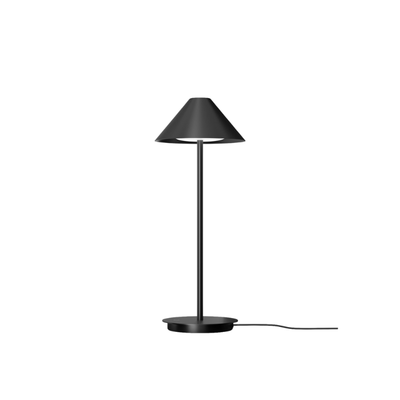 The Keglen table lamp’s distinctive conical shade has a built-in curved diffuser. This ensures an attractive and glare-free downwardly directed light. The stem morphs into the diffuser shade, folding inward and creating a beautiful organic geometry. A gentle light is also emitted upward through a discreet uniform opening in the top of the shade to create a perfect ambiance. Designed by Jakob Lange.