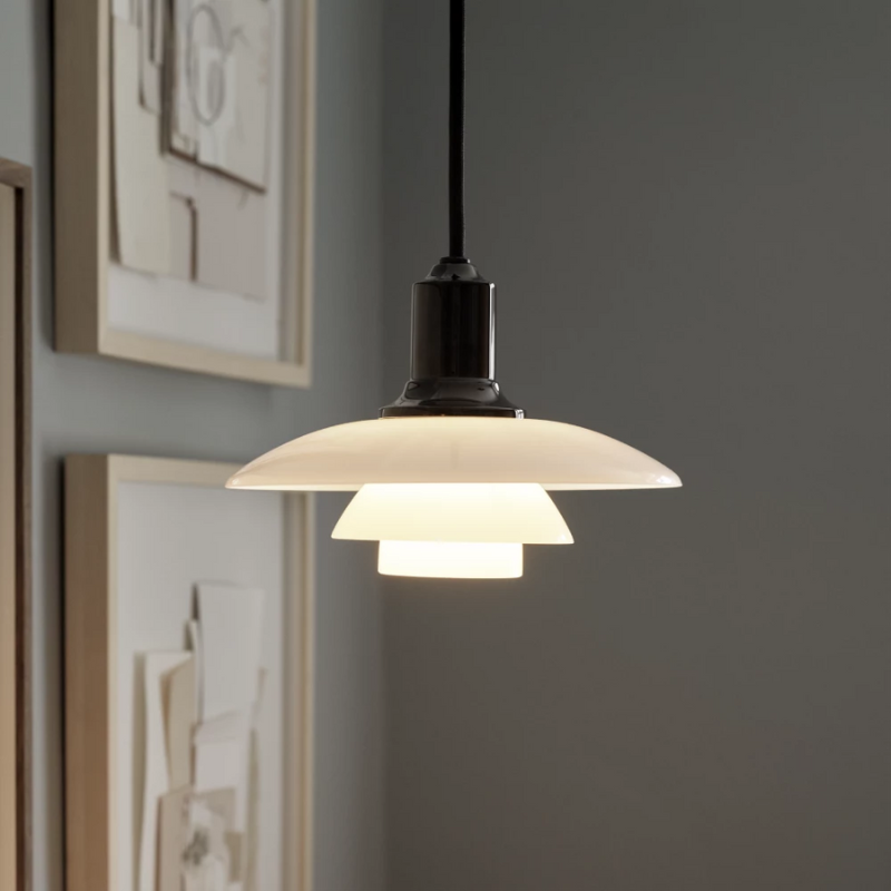 The PH 2/1 Pendant from Louis Poulsen in a living room.