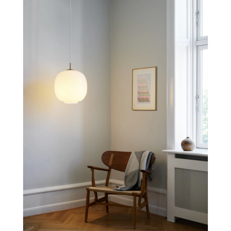 The VL45 Radiohus Pendant from Louis Poulsen in a lounge lifestyle photograph.