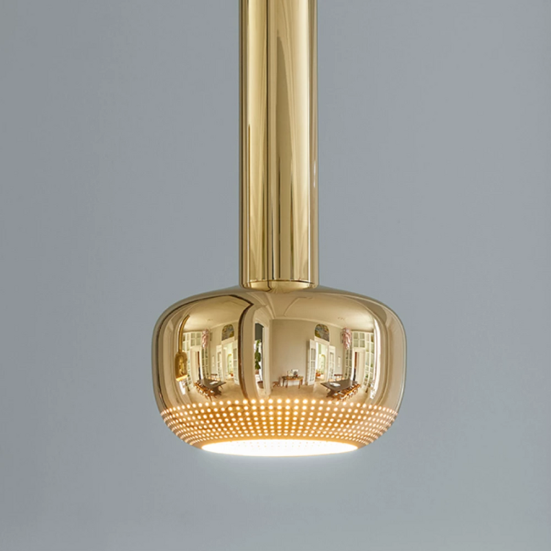 The VL 56 Pendant from Louis Poulsen in a dining room.