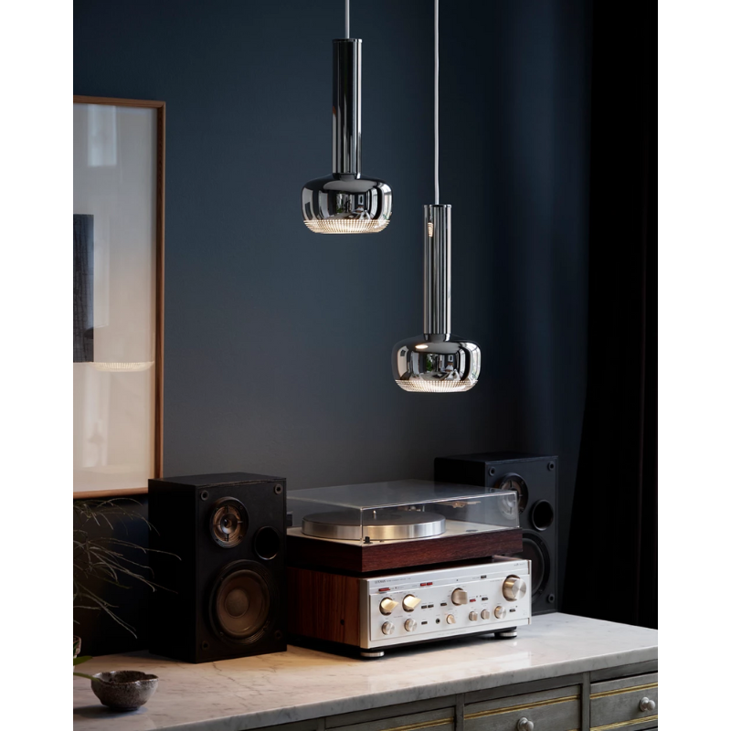 The VL 56 Pendant from Louis Poulsen in a lounge lifestyle photograph.