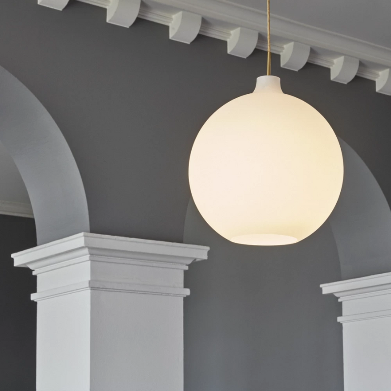 Designed by Danish architect Vilhelm Wohlert, the Louis Poulsen Wohlert Pendent features a simple and timeless globe design. 