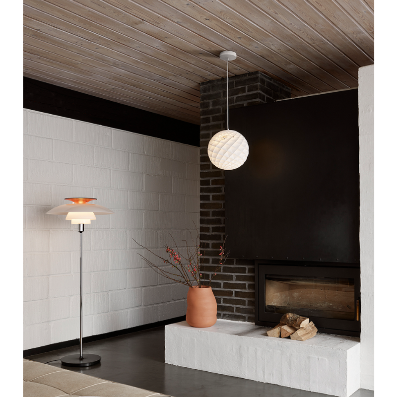 The Patera pendant is a glowing sphere built up of small diamond-shaped cells. Each cell is carefully designed to capture light and to shield the light source from the viewing angles above 45 degrees. Each cell glows. Below 45 degrees, the fields are open to direct light downwards. A small amount of light is also sent upwards to illuminate the ceiling. Designed by Danish designer Øivind Slaatto who took inspiration from the Fibonacci spiral.