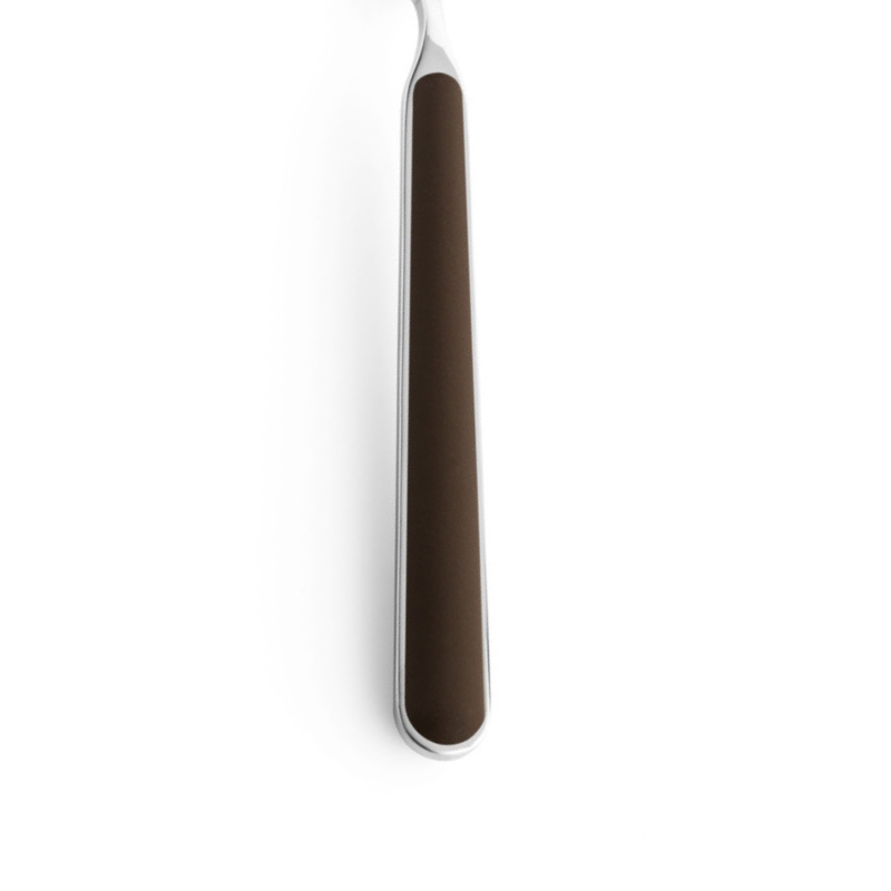 The handle color of the flatware pieces in the Fantasia 36 Piece Cutlery Set from Mepra in tobacco.