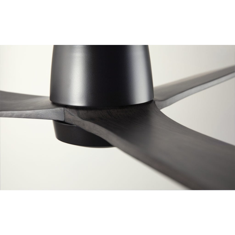 The Arbor Flush DC - 54" ceiling fan from The Modern Fan Co. in a close up shot showing the solid oak blades of the fan.