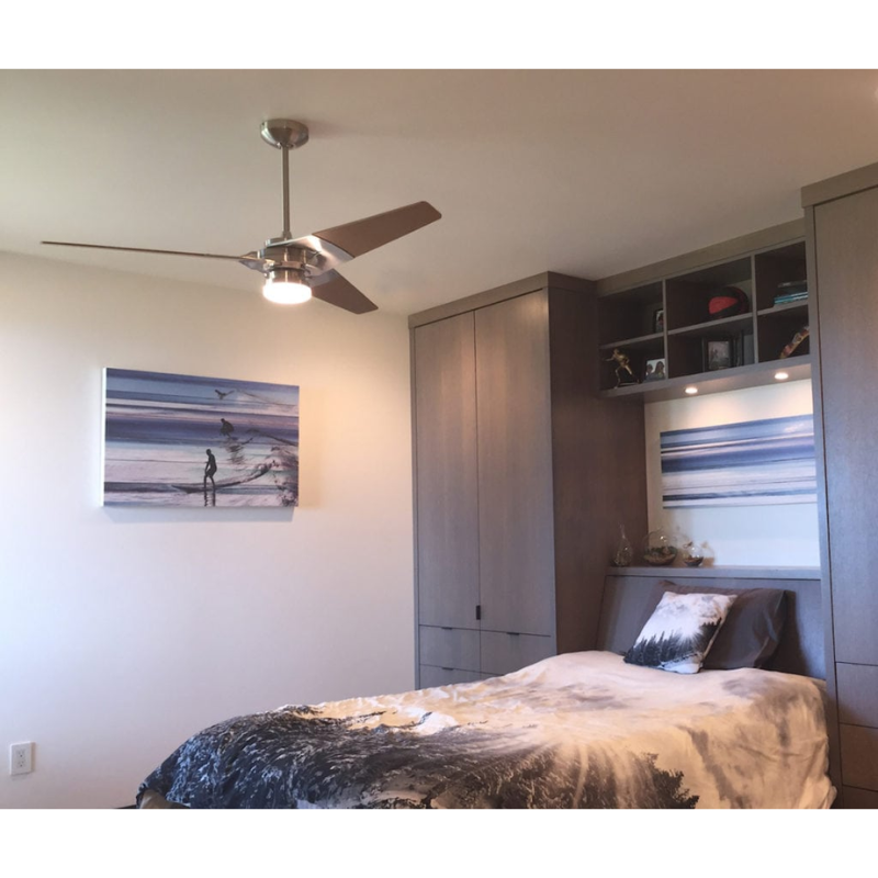 The Torsion 20W LED - 52" from The Modern Fan Co. in a guest room.