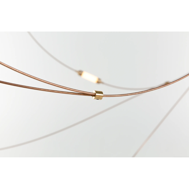 Flock of Light, by Studio Toer, transforms from a light and airy artistic design piece at daytime to a swarm of bright, warm lights at night. A swarm captured in stillness.