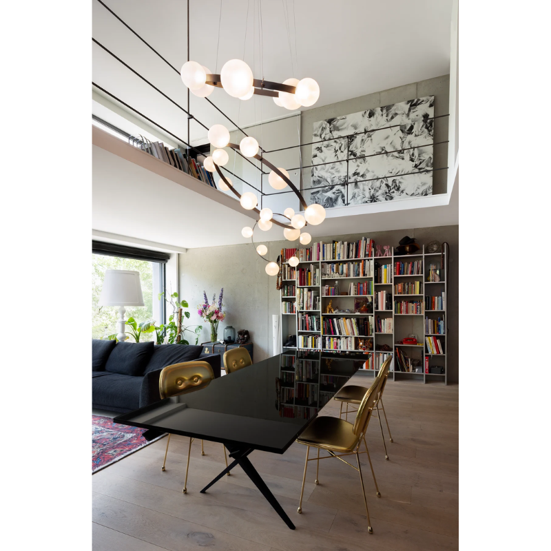 Hubble Bubble, designed by Marcel Wanders, is an airy and joyful suspension lamp. Available in two sizes, with either 7 or 11 glass LED bubbles in oil-iridescent or frosted versions. Hubble Bubble can be hung both horizontally and vertically and is powered through Electrosandwich® by Marcel Wanders. Hubble Bubble is the cheery statement piece in your home that can hang from any angle.