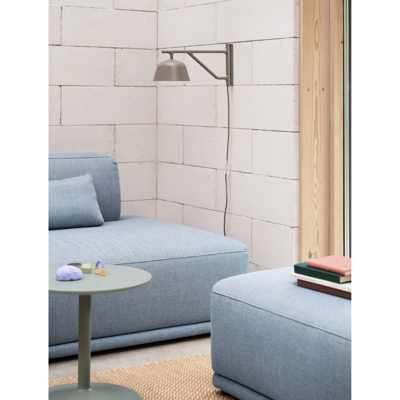The Ambit Wall Lamp from Muuto in a living room.