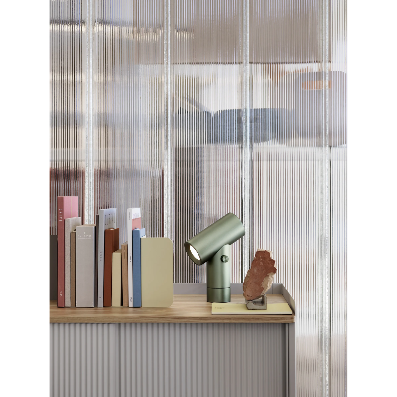 The Beam Table Lamp from Muuto on a desktop.