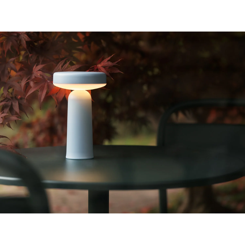 The Ease Portable Lamp from Muuto on a table top.