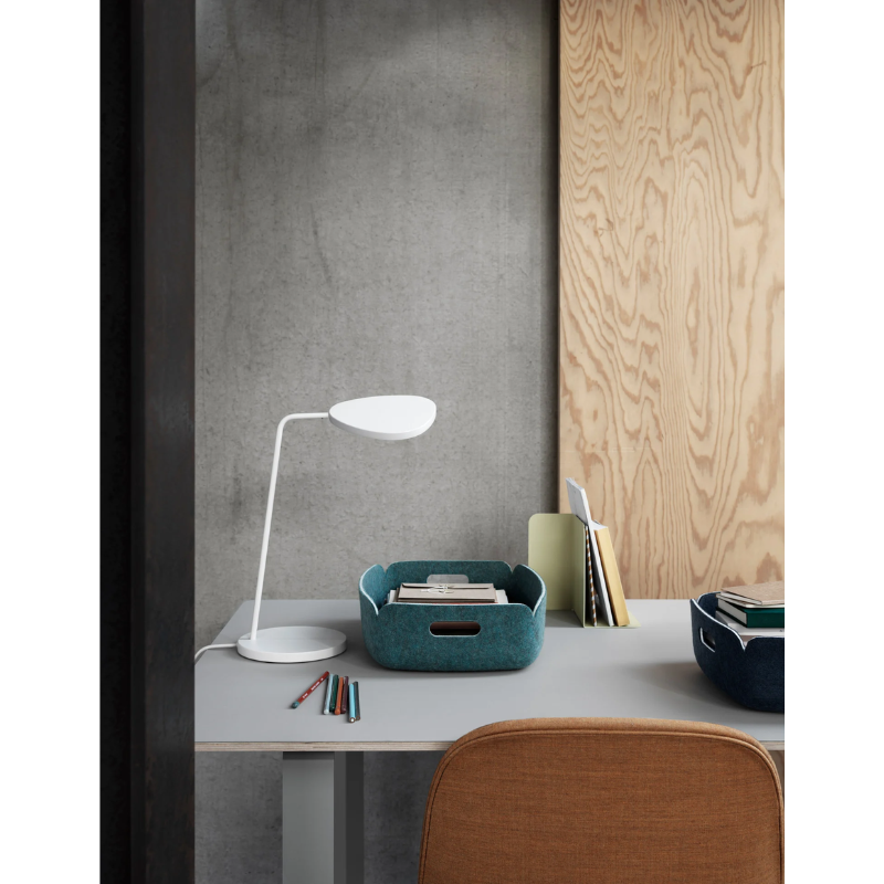 The Leaf Table Lamp from Muuto in a work space.