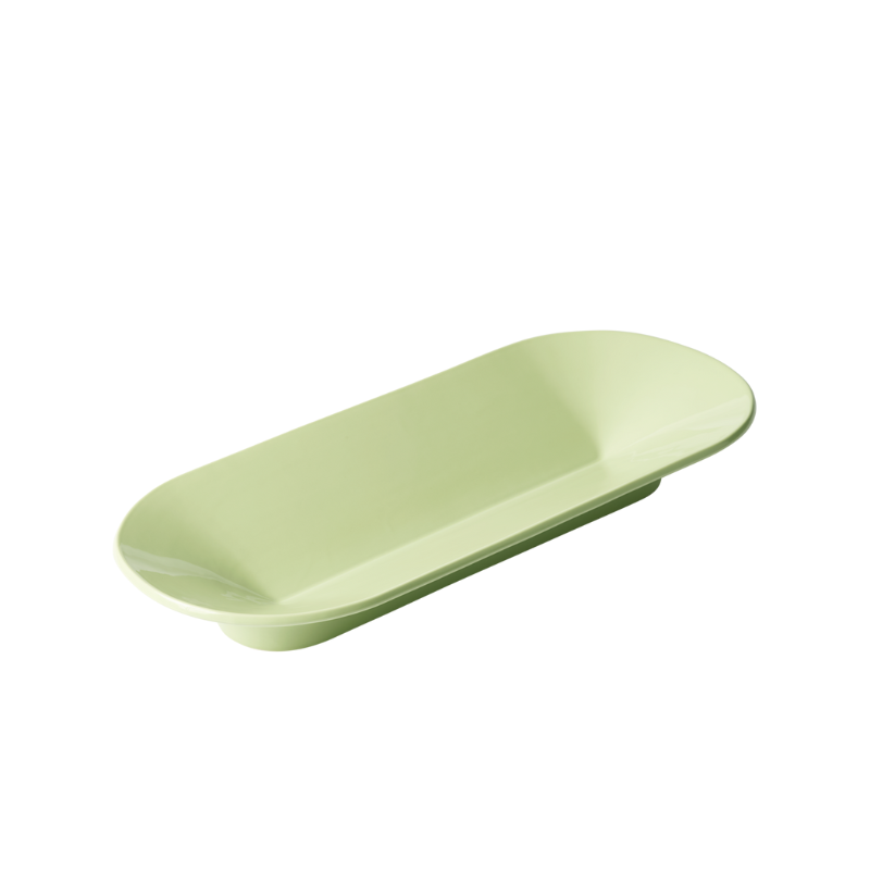The long Mere Bowl from Muuto in light green.
