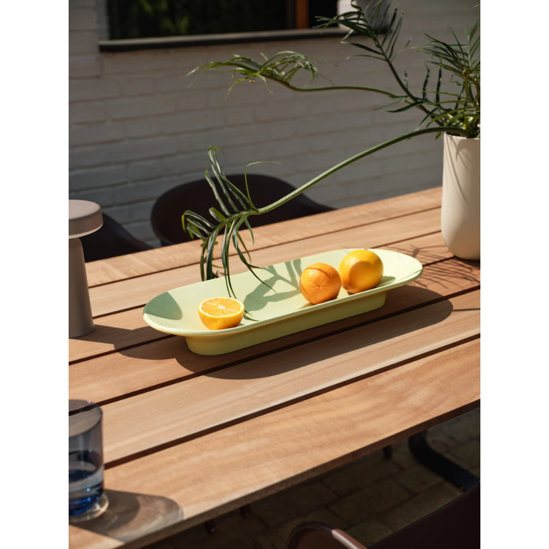The Mere Bowl from Muuto in an outdoor dining area.