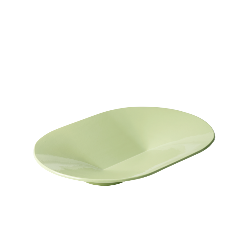 The wide Mere Bowl from Muuto in light green.