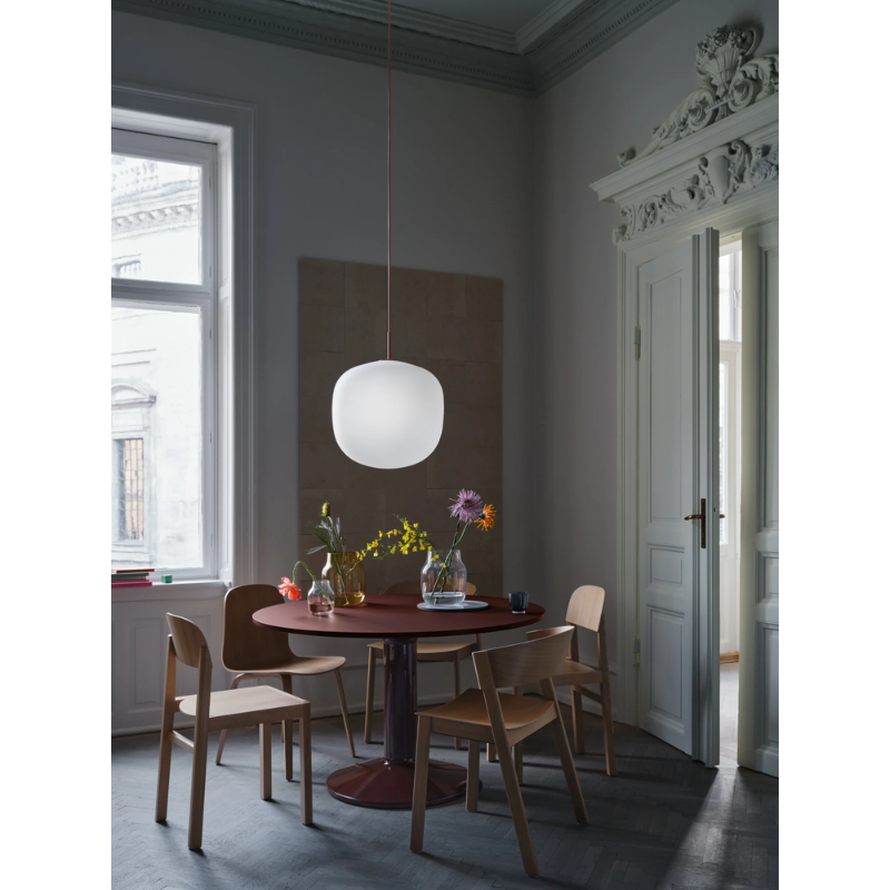 The Rime Pendant Lamp from Muuto above a dining table.