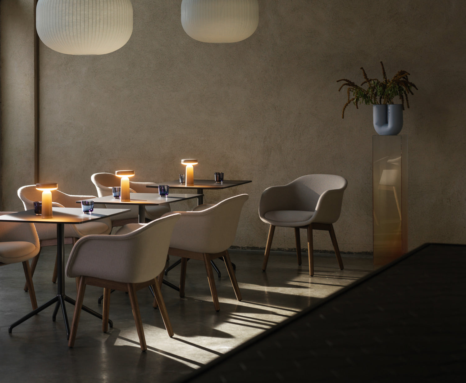 A lifestyle photograph of Muuto pieces being used in a cafe.