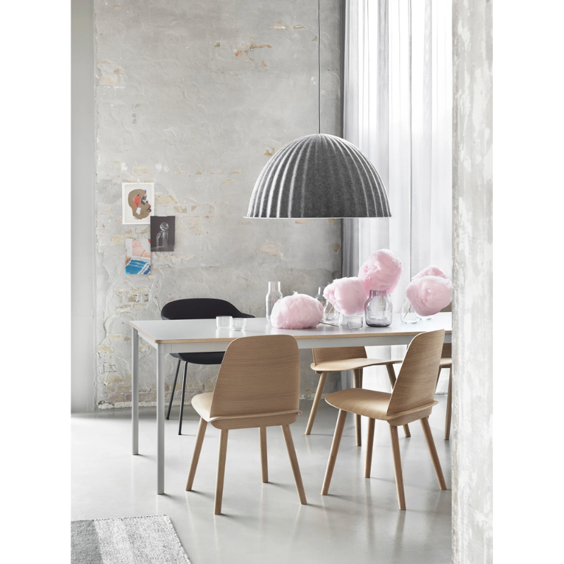 The Under the Bell Pendant Lamp from Muuto in a family space.