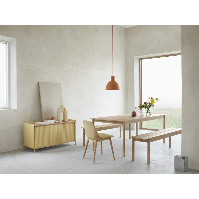 The Unfold Pendant Lamp from Muuto in a living room.