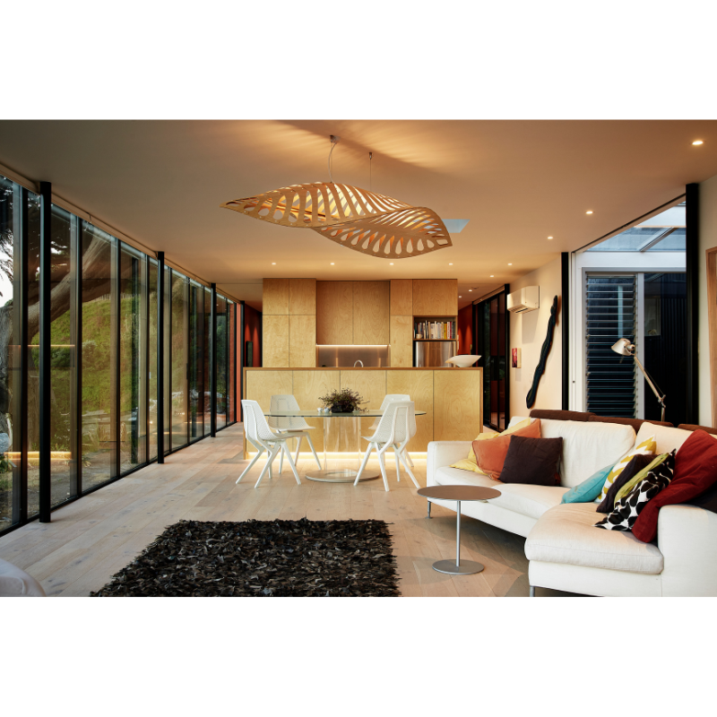 Four Cloud Move Chairs from Noho around a dining table in an open space home.
