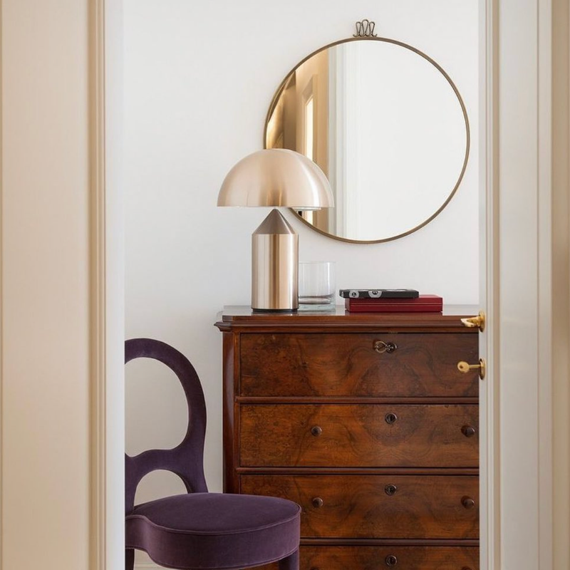 This is the Atollo Gold Table Lamp from Oluce on top of a dresser.