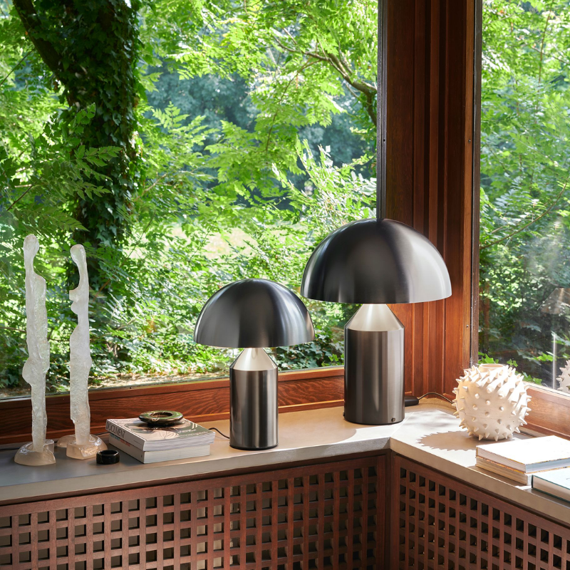 This is the Atollo Nickel Table Lamp from Oluce on a counter.