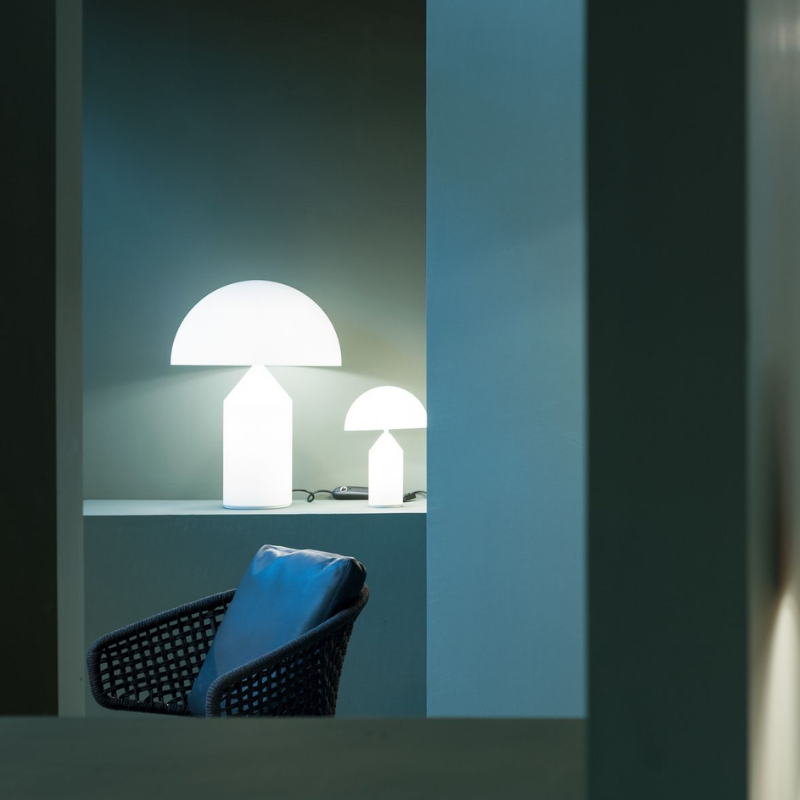 Designed in 1977 by Vico Magistretti, over the years, Atollo has become the archetype of the table lamp, winning the Compasso d Oro in 1979 and completely revolutionizing the way we imagine the classic bedside lamp. The geometric shapes that compose it, cylinder, cone and hemisphere, have resulted in a product that is decorative and essential at the same time, disconnected from the historical period and the fashions of the moment, and one that has now fully become one of the icons of Italian design.