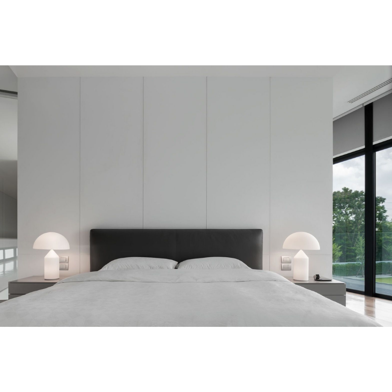 Designed in 1977 by Vico Magistretti, over the years, Atollo has become the archetype of the table lamp, winning the Compasso d Oro in 1979 and completely revolutionizing the way we imagine the classic bedside lamp. The geometric shapes that compose it, cylinder, cone and hemisphere, have resulted in a product that is decorative and essential at the same time, disconnected from the historical period and the fashions of the moment, and one that has now fully become one of the icons of Italian design.