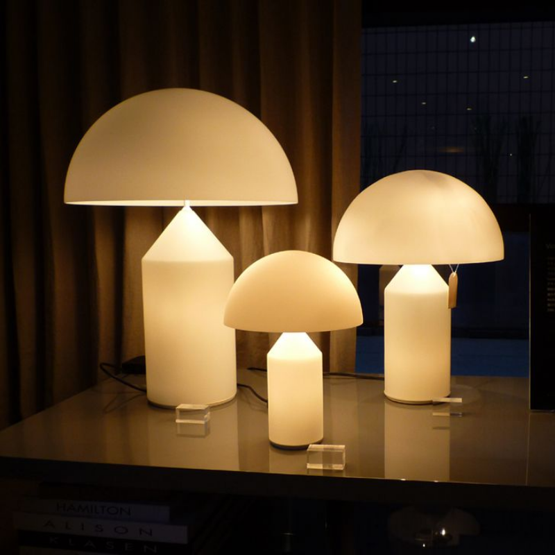Designed in 1977 by Vico Magistretti, over the years, Atollo has become the archetype of the table lamp, winning the Compasso d Oro in 1979 and completely revolutionizing the way we imagine the classic bedside lamp. The geometric shapes that compose it, cylinder, cone and hemisphere, have resulted in a product that is decorative and essential at the same time, disconnected from the historical period and the fashions of the moment, and one that has now fully become one of the icons of Italian design.