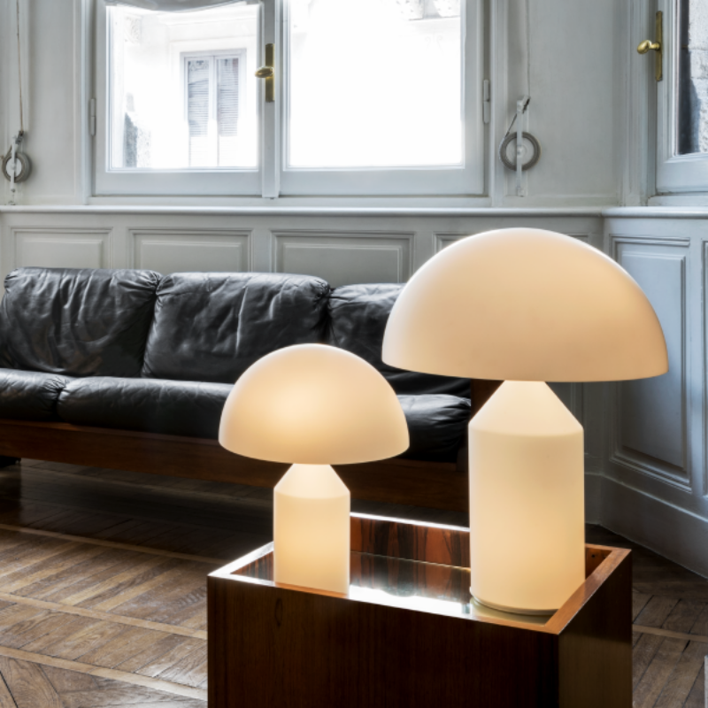 Designed in 1977 by Vico Magistretti, over the years, Atollo has become the archetype of the table lamp, winning the Compasso d Oro in 1979 and completely revolutionizing the way we imagine the classic bedside lamp. The geometric shapes that compose it, cylinder, cone and hemisphere, have resulted in a product that is decorative and essential at the same time, disconnected from the historical period and the fashions of the moment, and one that has now fully become one of the icons of Italian design.