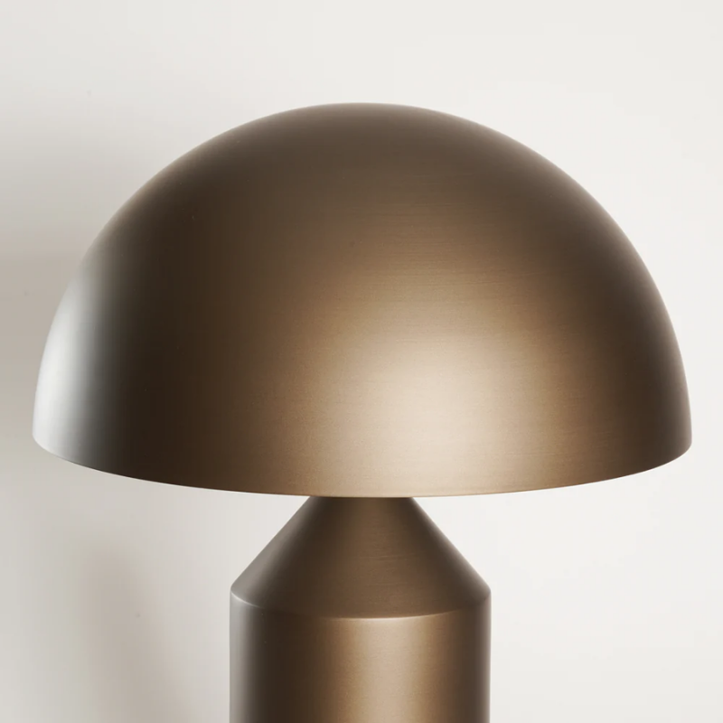 This is a close up of the Atollo Satin Bronze Table Lamp from Oluce.